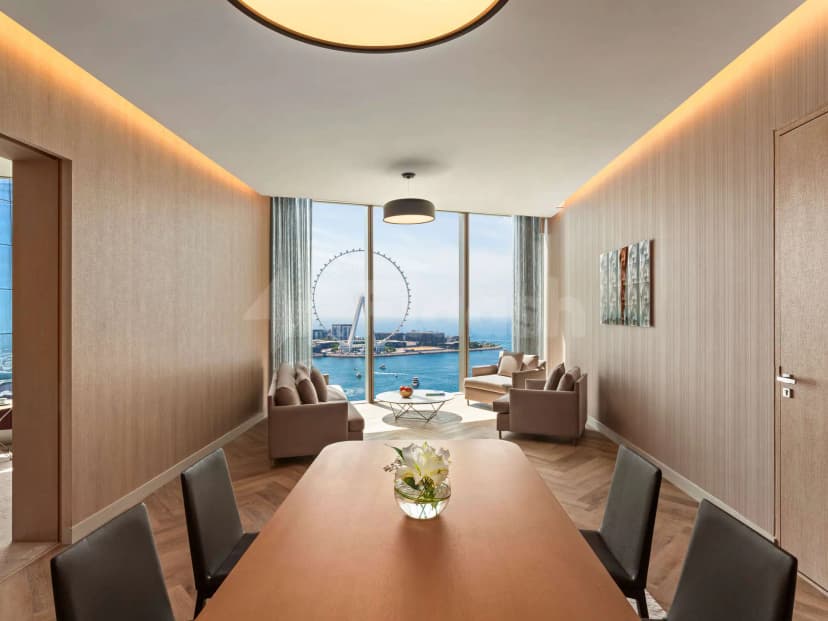 Meeting room at Rixos Premium Dubai JBR Hotel with floor-to-ceiling windows overlooking the sea and Ain Dubai