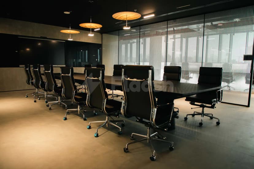 Boardroom at AXD Space Membership Club in Dubai with circular wooden pendant lights