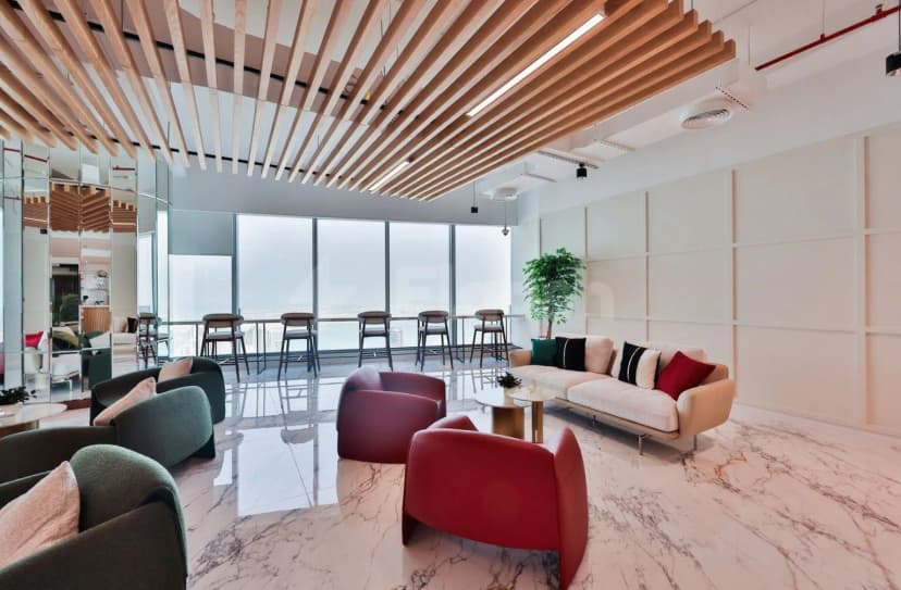 Entrance Hall at The Place Dubai Chambers featuring marble flooring, wooden ceiling slats, and large floor-to-ceiling windows