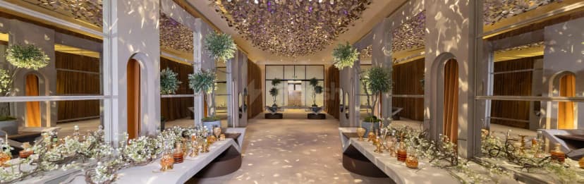 Long mirrored entrance hall at Al Jawaher Reception and Convention Centre in Sharjah with metallic leaf ceiling installation
