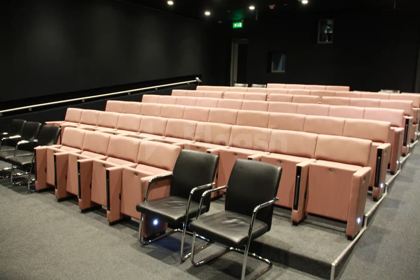 Tiered seating at The Blue Hall Abu Dhabi with fixed armrests and stepped floor