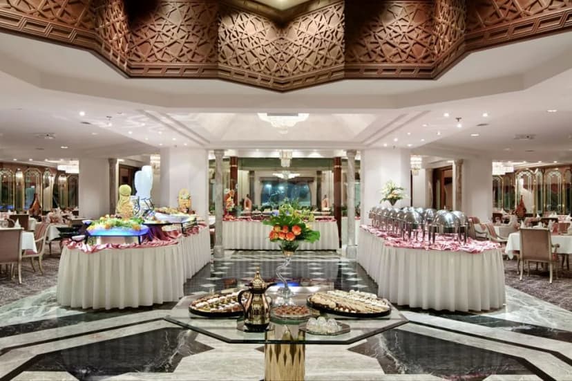 Ballroom at Makkah Towers Al Khalil in Makkah featuring an ornate wooden ceiling and marble floor with buffet