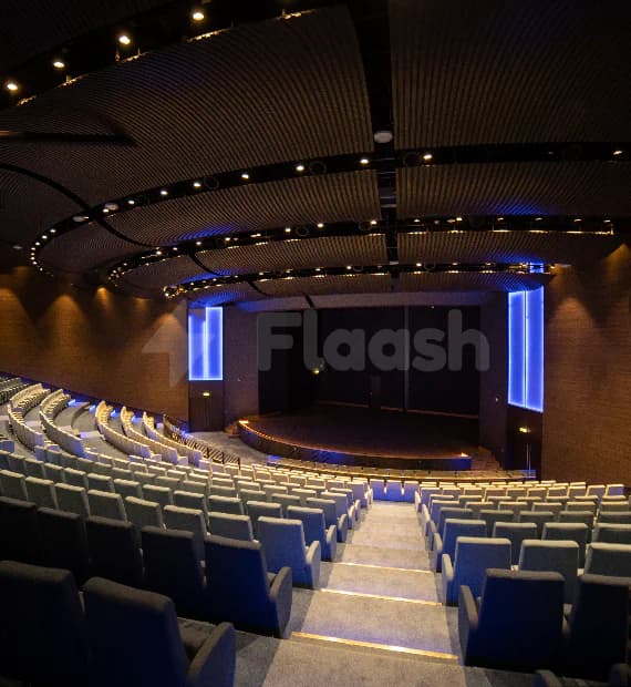 Tiered auditorium at Jafza One Convention Centre in Dubai with curved acoustic ceiling