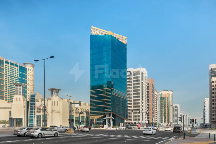 Hotel facade at La Quinta by Wyndham Abu Dhabi Al Wahda with blue glass and gold trim