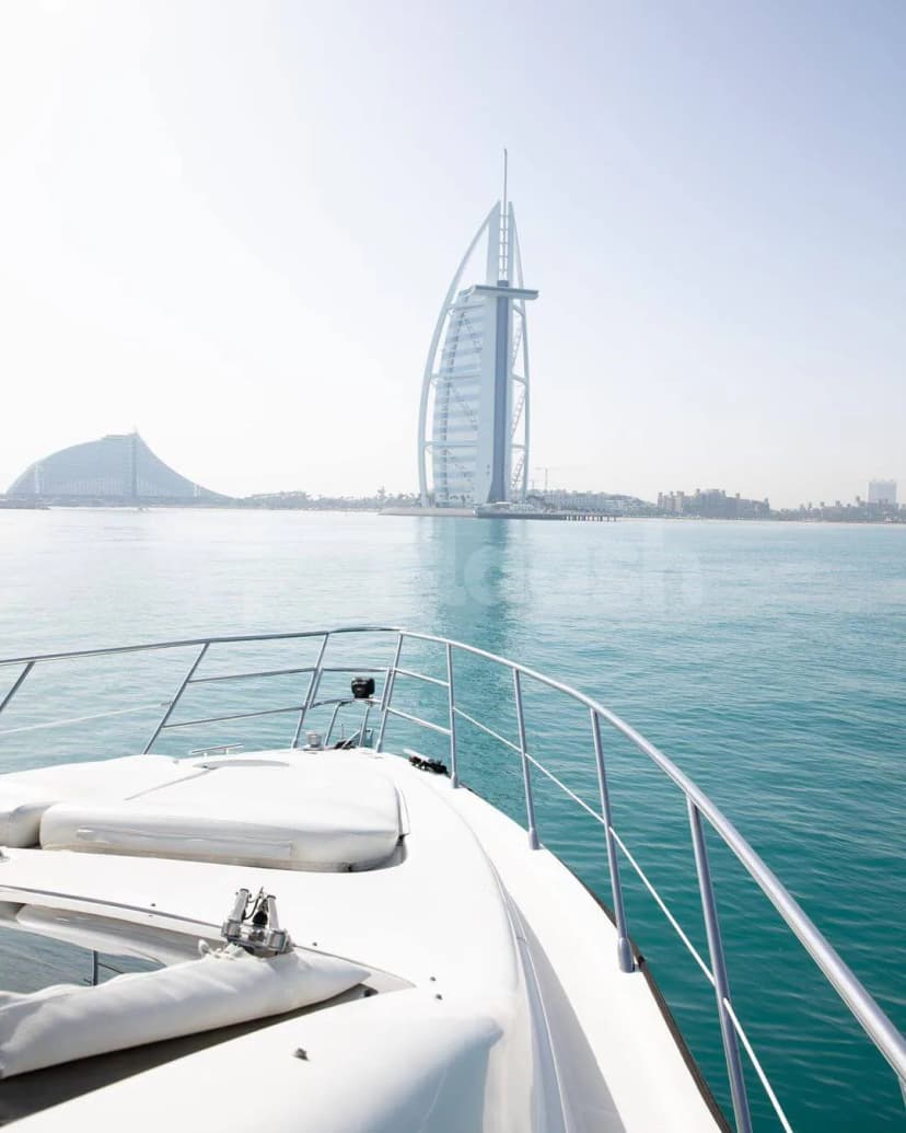 Yacht deck at Azimut 62 Lucky Star Yacht in Dubai with Burj Al Arab visible ahead