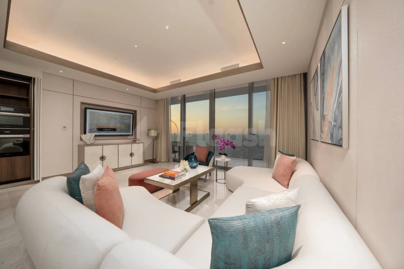Meeting room at Five Luxe JBR Dubai featuring a white curved sofa and floor-to-ceiling windows with coastal