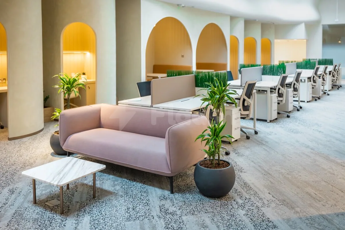 Open-plan meeting room at Cloud Spaces Mall World Trade Center Abu Dhabi with arched alcoves and warm lighting