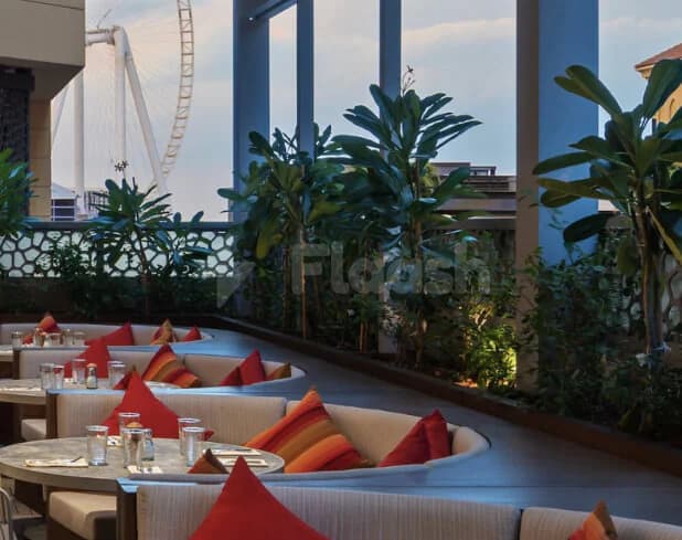 Rooftop terrace at JA Ocean View Hotel in Dubai with potted tropical plants
