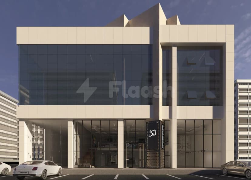 Modern beige-clad facade of Lakum Artspace in Riyadh Umm Al Hamam Al Gharbi featuring large glass windows
