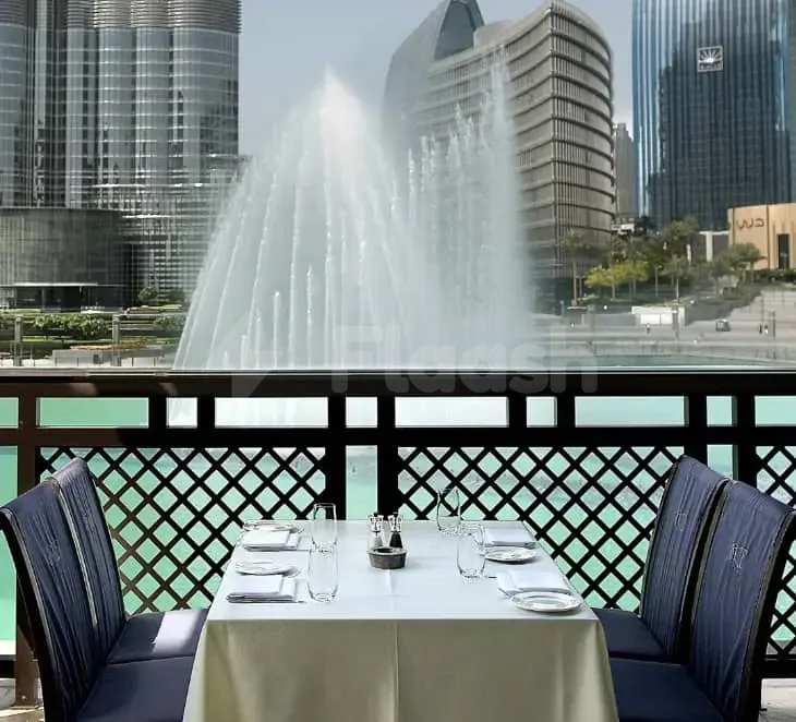 Rooftop terrace at Bice Mare Restaurant Dubai with a formal dining table and a view of the water