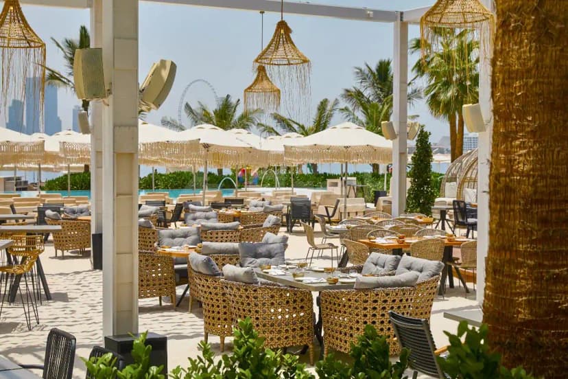 Rooftop terrace at Playa Dubai in Dubai with hanging wicker lanterns and pool view