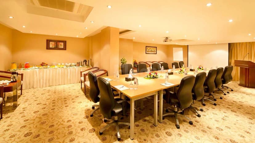 Boardroom at Coral Jubail in Al Jubail with floral centerpieces on the table