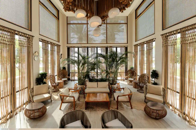 Entrance hall at Saadiyat Beach Club Luxury Beach Club in Abu Dhabi featuring high ceilings, large windows