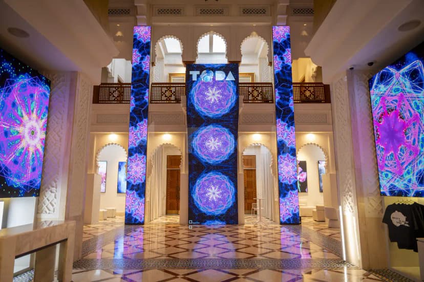 Entrance hall at TODA - Theatre Of Digital Art in Dubai with illuminated vertical LED columns displaying abstract art
