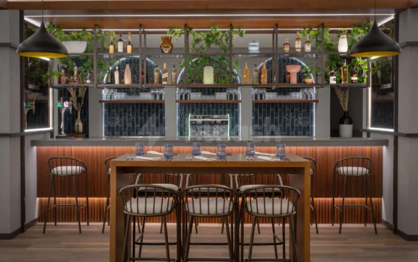 Restaurant at JA Ocean View Hotel Dubai featuring a bar counter with blue tiled backsplash and wooden slat