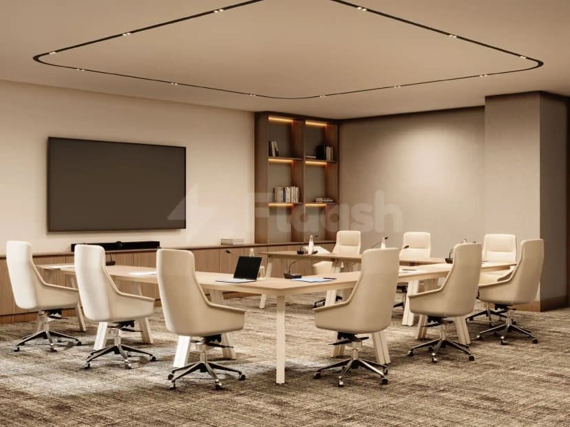 Boardroom at Vintage Grand Hotel Dubai featuring a long wooden table, white leather chairs with black bases