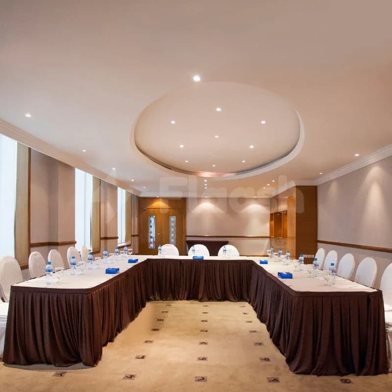 Meeting Room at Marina Byblos Hotel Dubai featuring u-shaped table layout and circular ceiling light feature
