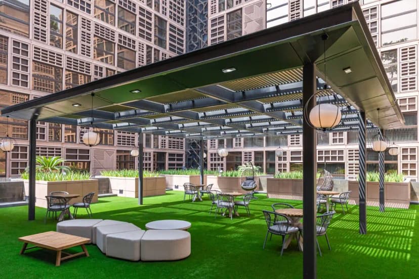 Rooftop terrace at Cloud Spaces Mall World Trade Center Abu Dhabi with metal pergola and hanging spherical lights