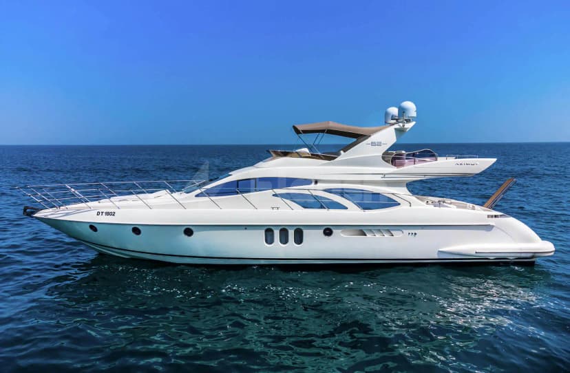 White Azimut 62 Lucky Star Yacht Dubai on calm blue sea with flybridge seating and brown canvas awning