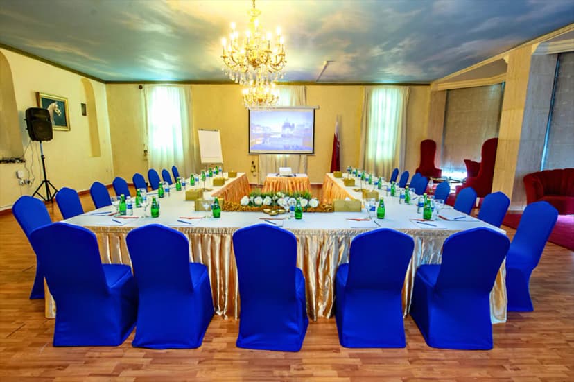 Boardroom at Tio Sea Resort Qatar in Doha with sky-painted ceiling and chandelier