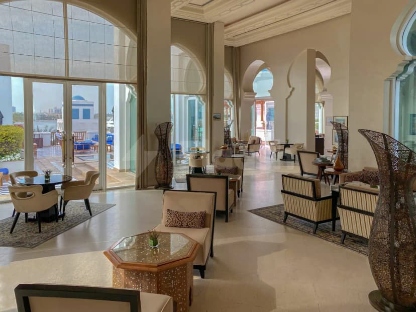 Entrance hall at Dubai Creek Golf & Yacht Club in Dubai with arched doorways and waterfront view