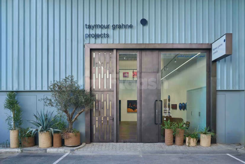 Entrance hall of Taymour Grahne Projects at Alserkal Avenue Dubai featuring bronze double doors with vertical slats