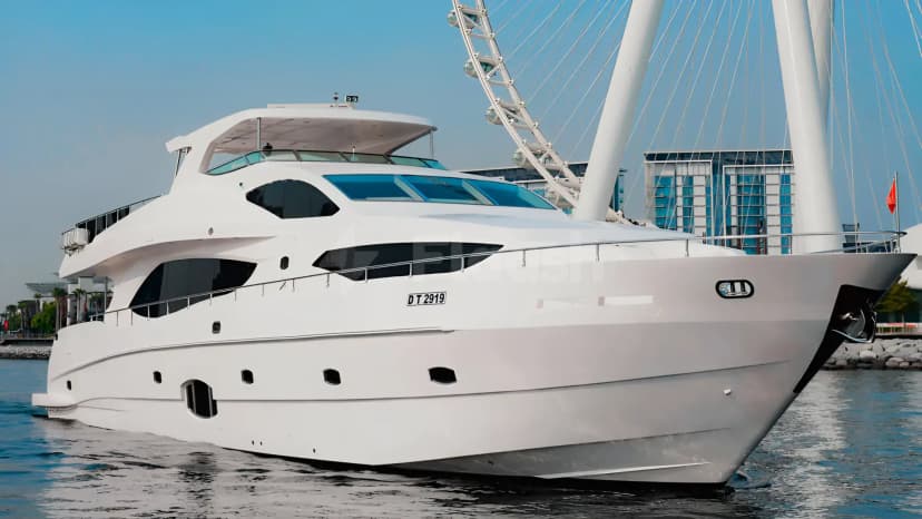 White yacht Xclusive 35 Yacht Dubai with sleek hull, tinted windows, and registration DT 2919 docked in marina