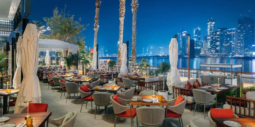 Rooftop terrace at Grand Zor Restaurant Dubai with waterfront city skyline view at night