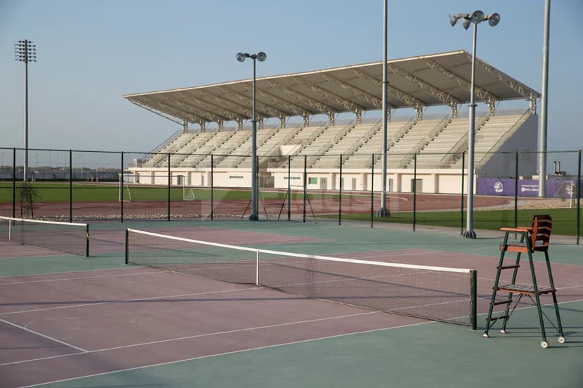 Tennis court at NYU Abu Dhabi Athletic Field in Abu Dhabi with covered stadium seating