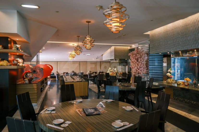 Kimuraya Authentic Japanese Restaurant Downtown Dubai features a modern dining space with spiral pendant lights and a pink