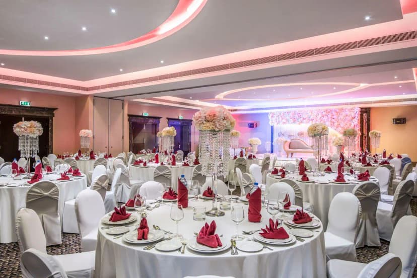 Ballroom at Metropolitan Al Mafraq Hotel in Abu Dhabi with pink ceiling lighting