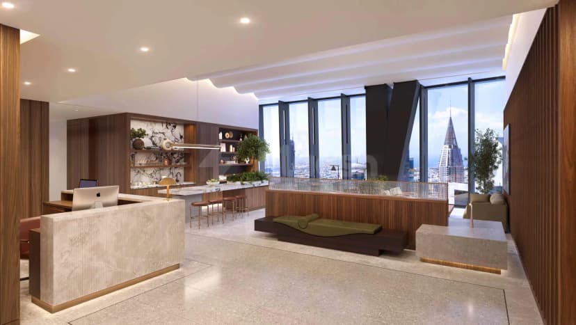 Entrance hall at ICD Brookfield Place Dubai featuring a marble reception desk and large floor-to-ceiling windows