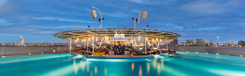 Rooftop terrace at Cafe del Mar Beach Club Abu Dhabi with illuminated infinity pool