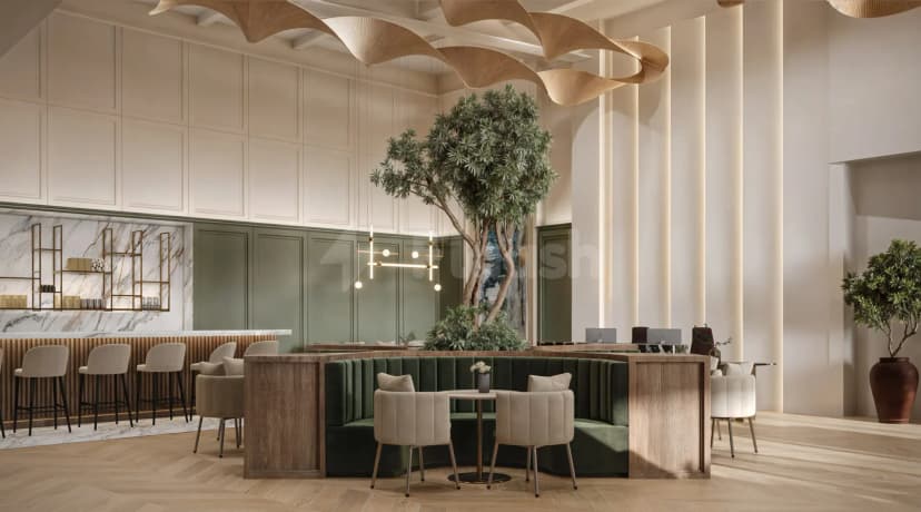 Restaurant at The Place Dubai Chambers featuring a green velvet booth and a tall indoor tree under