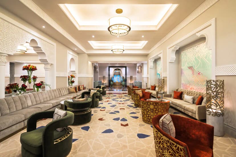 Entrance hall at Al Mashreq Boutique Hotel in Riyadh featuring ornate arched doorways and a geometric patterned floor