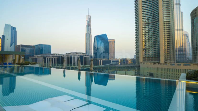 Rooftop terrace at Mosaic Pool Lounge & Bar Downtown Dubai featuring an infinity pool and glass railing with Dubai