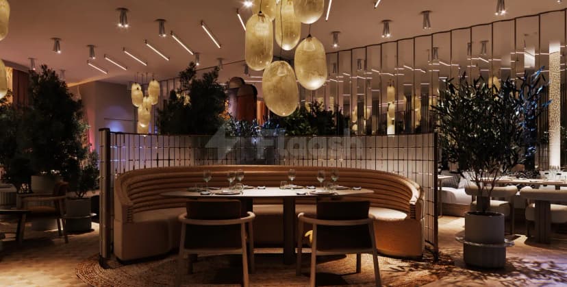 Curved booth seating at OSH Del Mar Restaurant Dubai Marina, featuring frosted glass pendant lighting and a mirrored