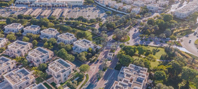 Landscaped garden at Dubai Silicon Oasis Authority in Dubai with palm trees and roundabout