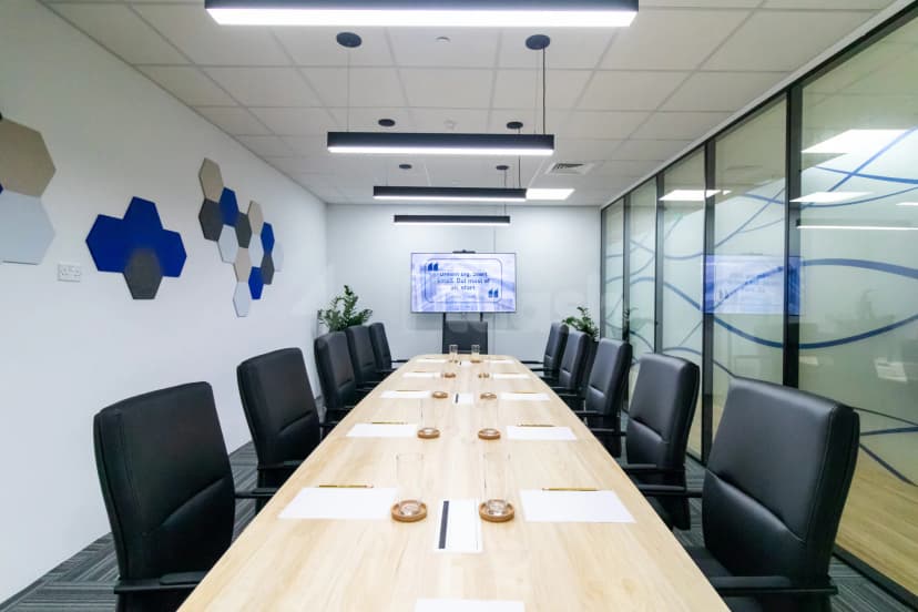 Boardroom at Hub Business Center Burj Marina Lusail with hexagonal wall art