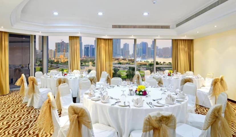 Ballroom at Al Majaz Premiere Hotel Apartments in Sharjah with panoramic city skyline view