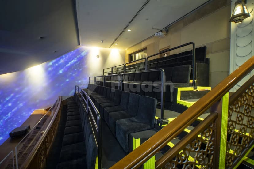 Tiered seating area at TODA - Theatre Of Digital Art in Dubai with yellow LED step lighting