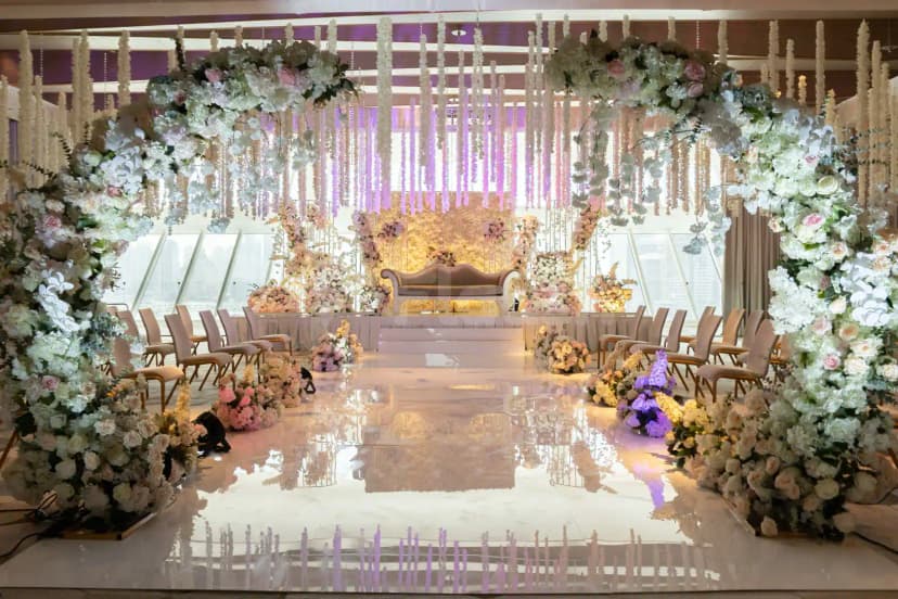 Ballroom at Five Luxe JBR in Dubai featuring a grand floral archway and hanging floral decorations