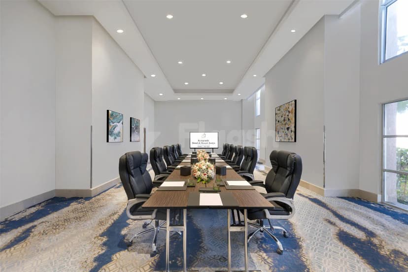 Boardroom at Kempinski Hotel & Resort Sariya in Yanbu featuring a long wooden table, black leather chairs