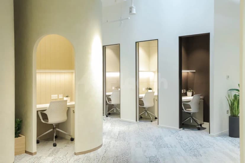 Meeting room at Cloud Spaces Mall World Trade Center Abu Dhabi featuring arched doorways and individual work pods