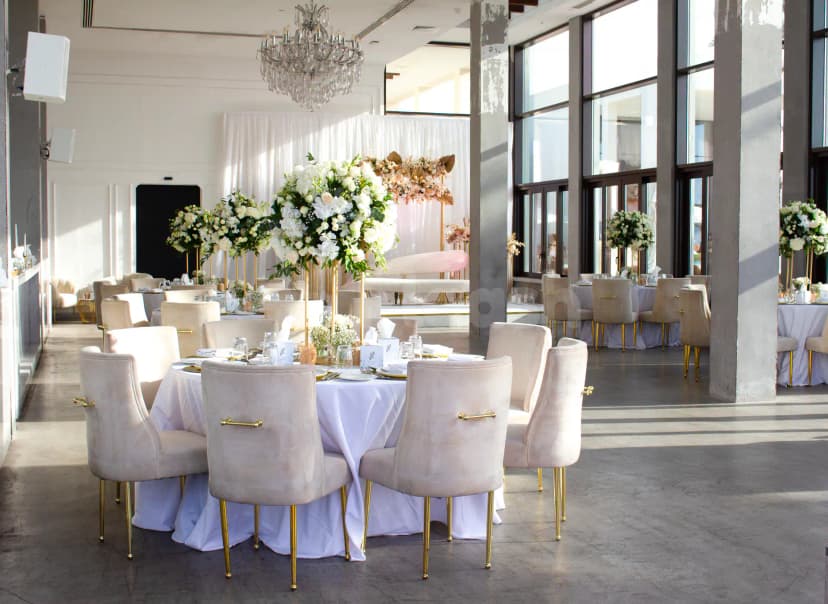 Ballroom at Saadiyat Beach Club Luxury Beach Club in Abu Dhabi with tall white floral centerpieces