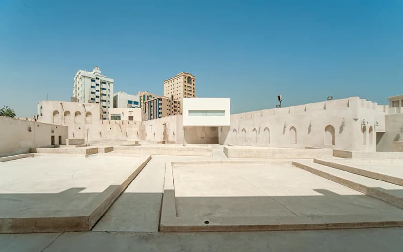 Rooftop terrace at The Flying Saucer Sharjah in Sharjah with raised concrete platforms and arched white walls