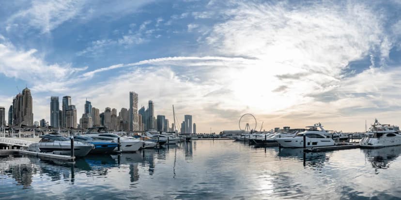 Rooftop terrace at Dubai Harbour Cruise Terminal in Dubai overlooking marina with luxury yachts and city skyline including