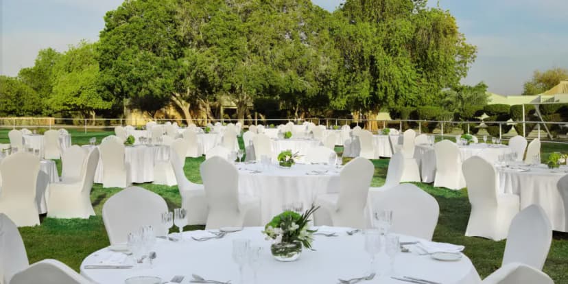 Rooftop terrace at InterContinental Al Jubail in Al Jubail with round tables set on manicured lawn