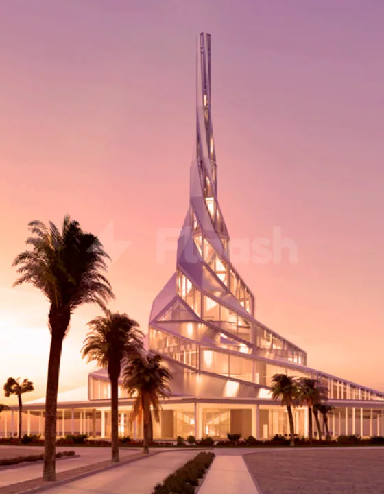 Sustainability & Innovation Centre Dubai facade featuring a tall vertical spire and angular glass structure illuminated at twilight