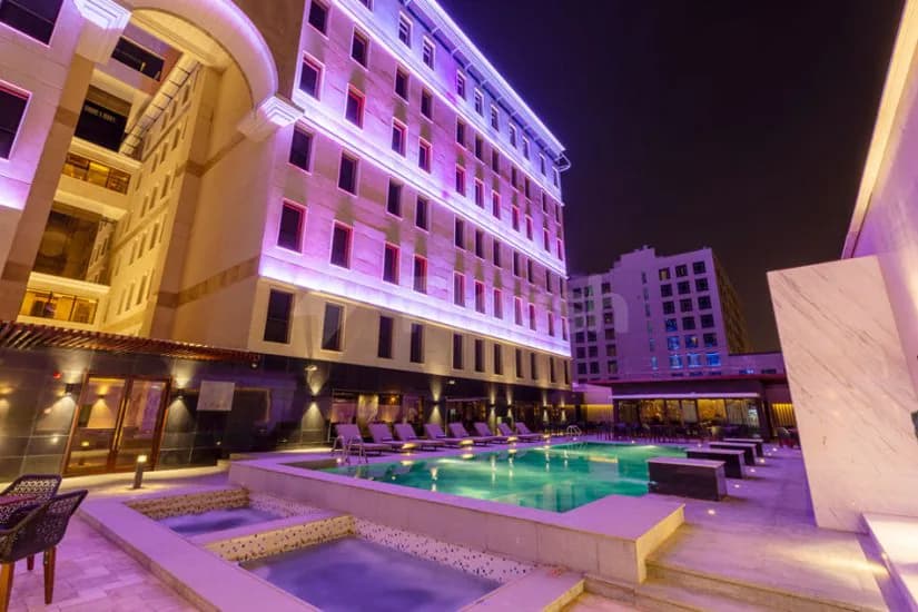Outdoor swimming pool at Joudyan King Road Jeddah by Elaf in Jeddah with adjacent hot tub
